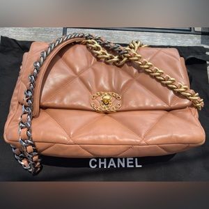 Chanel 19 made with quilted tan lambskin. Very soft, plush exterior.